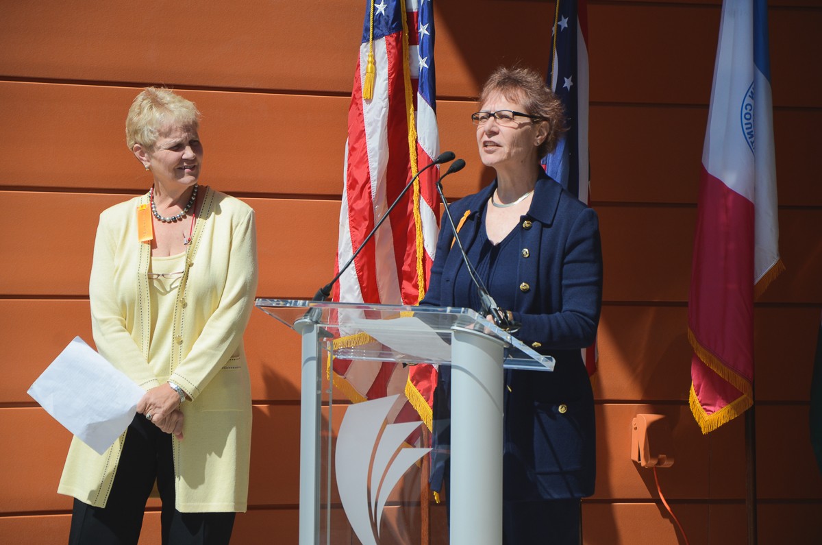 Carol's sisters speaking at the opening of the new space